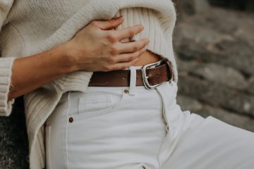 woman with hand on stomach