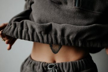 woman wearing half zipped sweatshirt