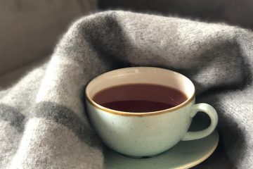 white ceramic cup on saucer