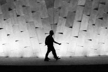 black and white photo of people walking