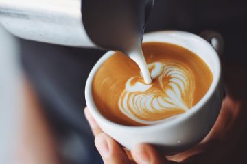 woman pouring cappuccino