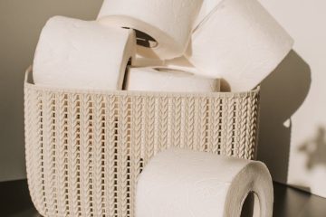 white toilet paper roll on woven basket