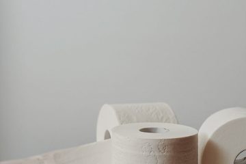 white toilet paper roll on white table