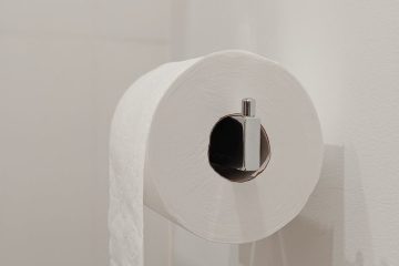 white toilet paper roll on silver holder