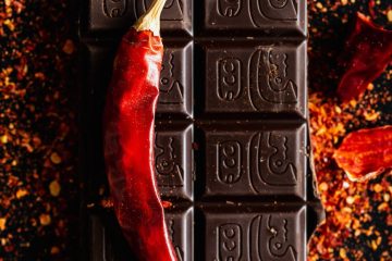 red pepper and bar of dark chocolate