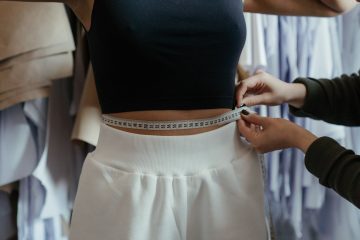 photo of person measuring woman s waist