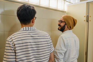 men at urinals