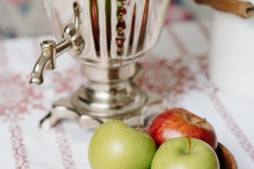 green apple fruit beside stainless steel pitcher