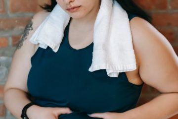 hopeless plus size woman demonstrating fold on stomach