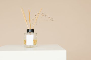 a reed diffuser on a white surface