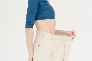 cheerful slender woman in oversized pants