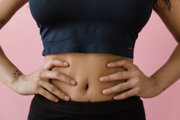 a woman hands on her belly